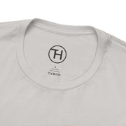 Close-up of the collar and label of a Pet Lovers Tee in white, showing fabric care details.