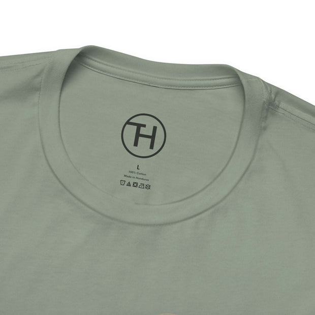 Close-up of a light green pet lovers tee showing the ribbed collar and brand tag, perfect for casual wear.