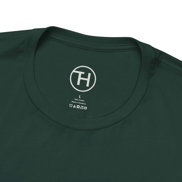 Close-up of the neckline of a dark green unisex jersey tee, featuring a size label and logo detail.