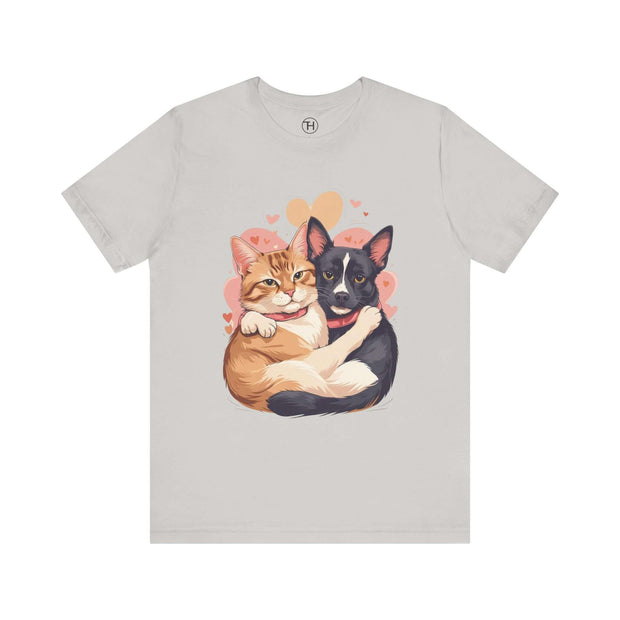 Cute pet lovers tee featuring an illustration of a hugging orange cat and black dog with hearts.