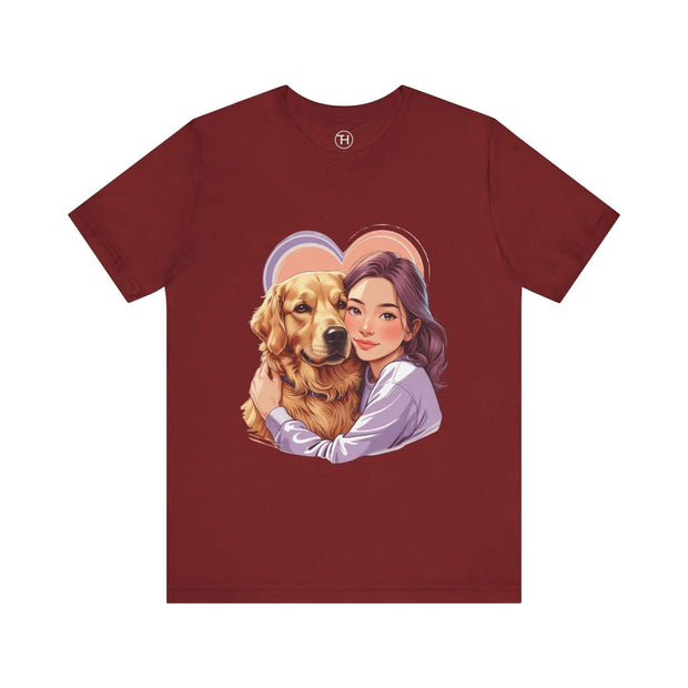 Heartwarming dog lover tee featuring a girl hugging a golden retriever on a maroon jersey shirt.