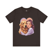 Heartwarming unisex dog lover tee featuring a girl hugging a golden retriever on a black shirt.