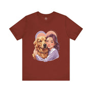 Heartwarming dog lover tee featuring a woman hugging a golden retriever on a cozy maroon shirt.