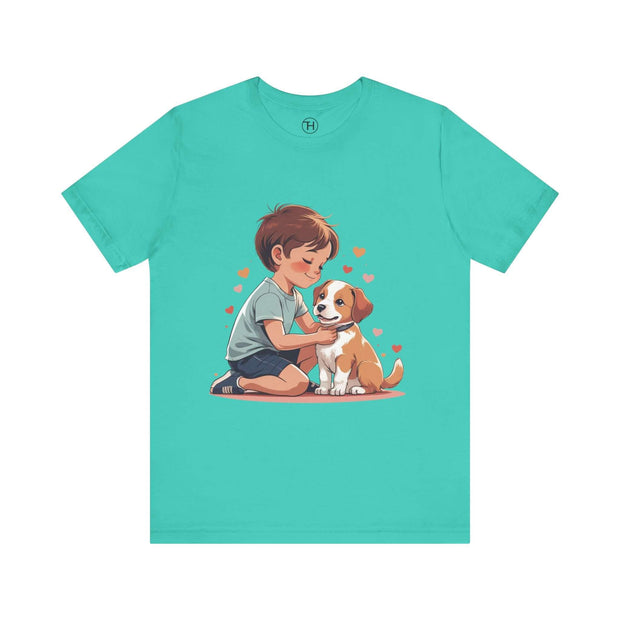 Boy showing affection to a puppy on a turquoise Kid & Puppy Love T-Shirt, perfect for dog lovers.