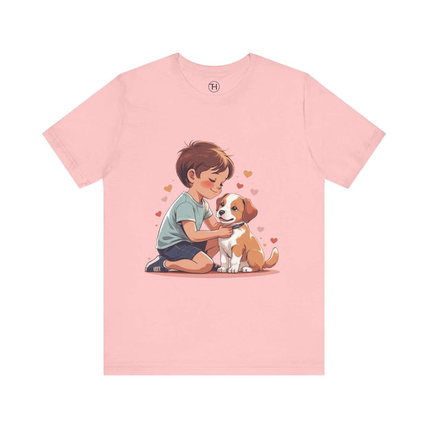 Kid & Puppy Love T-Shirt featuring a child and puppy in a heartwarming embrace on a pink shirt.