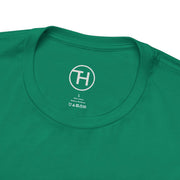 Close-up of a green unisex jersey short sleeve tee neck label, showcasing comfort and style for dog lovers.