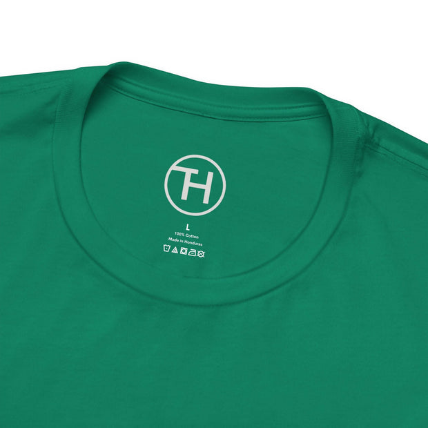 Close-up of a green unisex jersey short sleeve tee neck label, showcasing comfort and style for dog lovers.