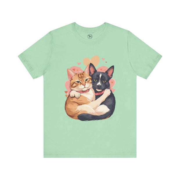 Cute pet lovers tee featuring an illustration of a cat and dog embracing with hearts, perfect for animal enthusiasts.