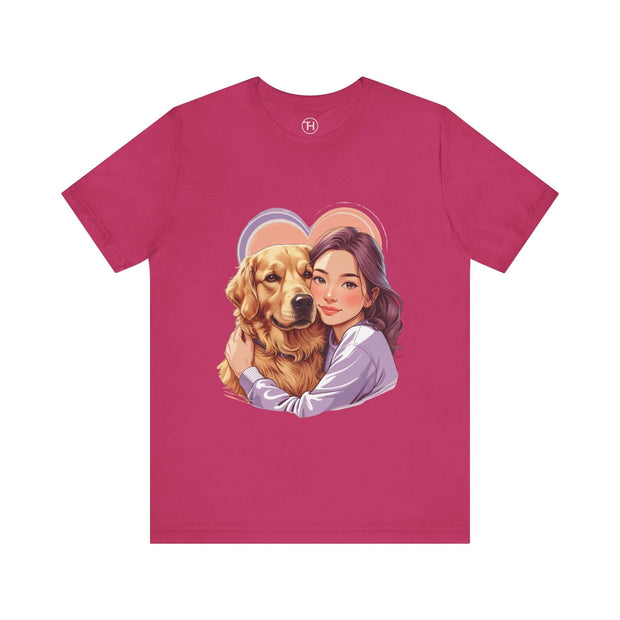 Heartwarming pink tee featuring a girl hugging a golden retriever, perfect for dog lovers.