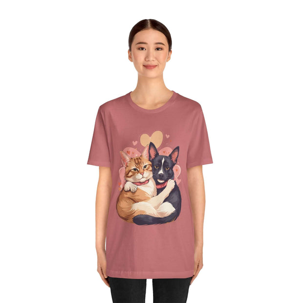 Woman wearing a pet lovers tee featuring a cute illustration of a cat and dog cuddling, ideal for animal enthusiasts.