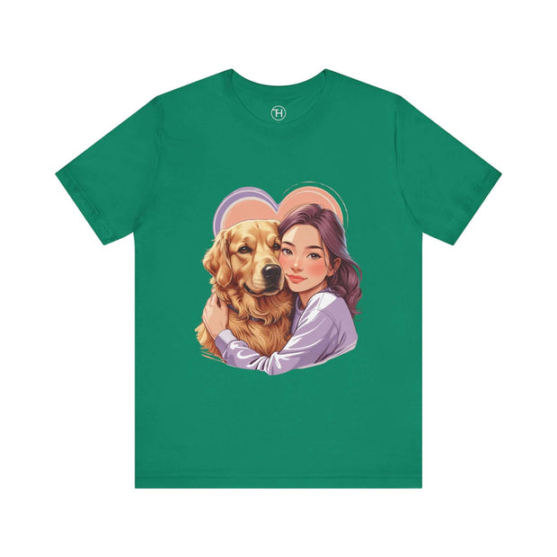 Heartwarming dog lover tee featuring a girl hugging a golden retriever on a green short sleeve shirt.
