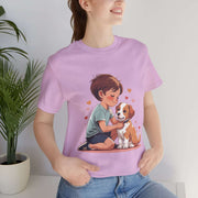 Kid wearing pink Kid & Puppy Love T-Shirt, smiling with a puppy, surrounded by heart graphics, perfect for dog lovers.